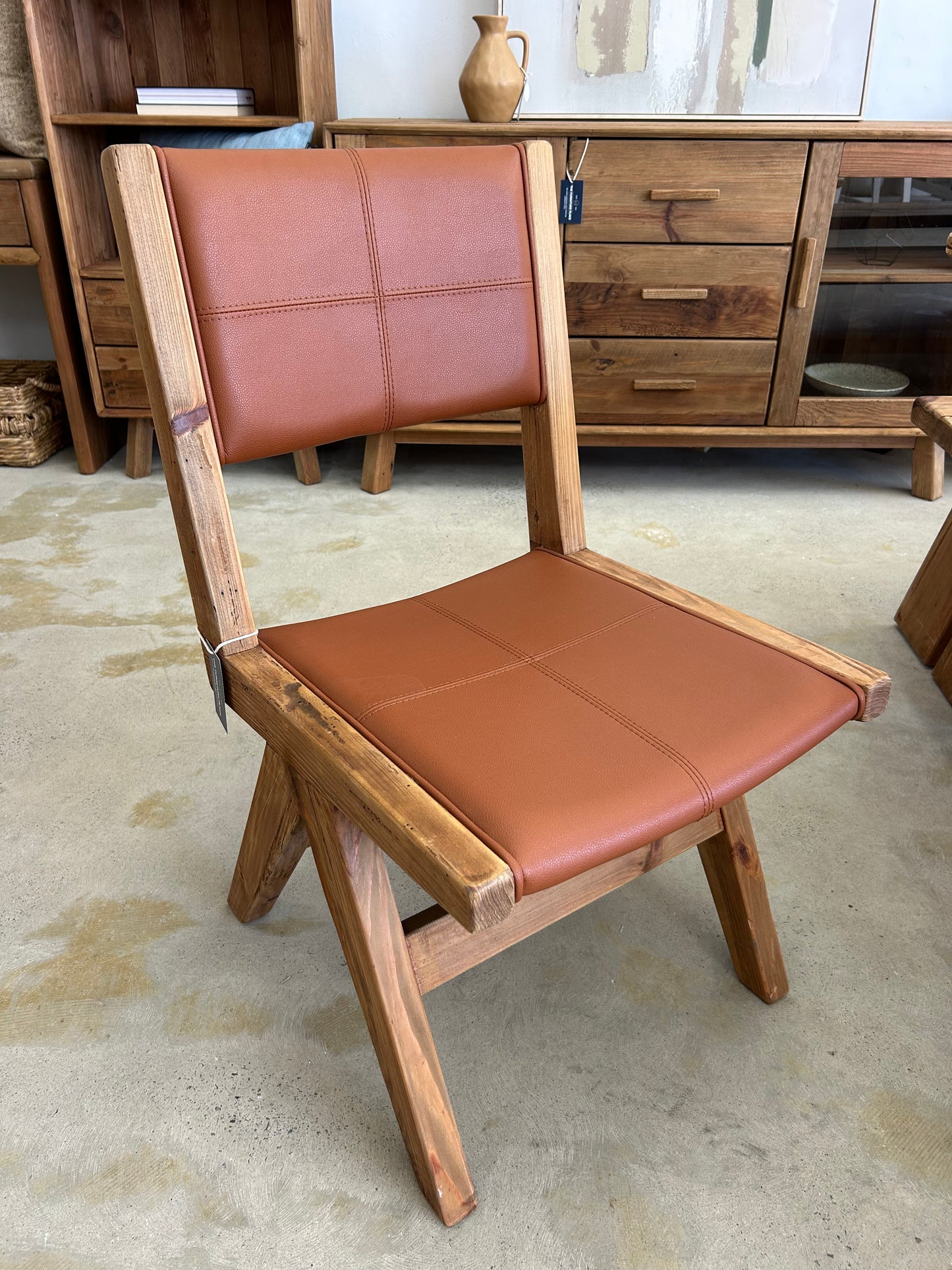 Rustic wooden dining chair with tan fabric