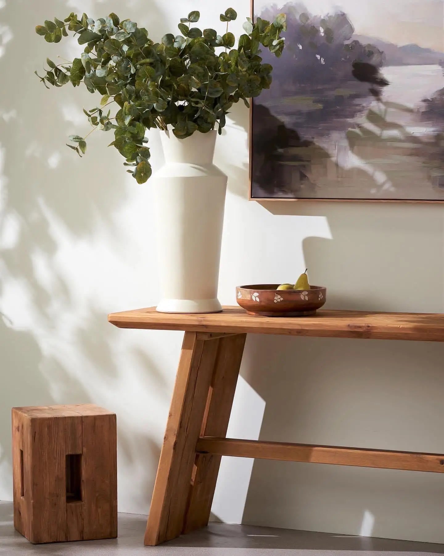 Farmhouse style wooden console table or hall table with angled legs and raw wood look