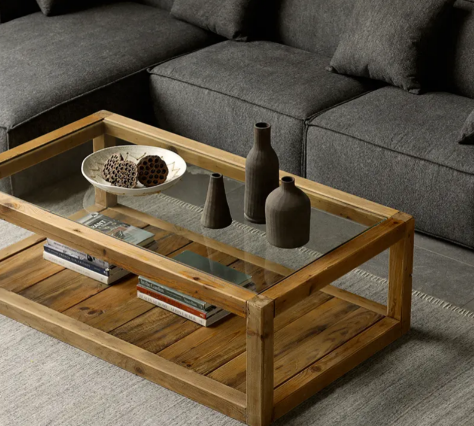 Large wooden coffee table with a modern design and glass top
