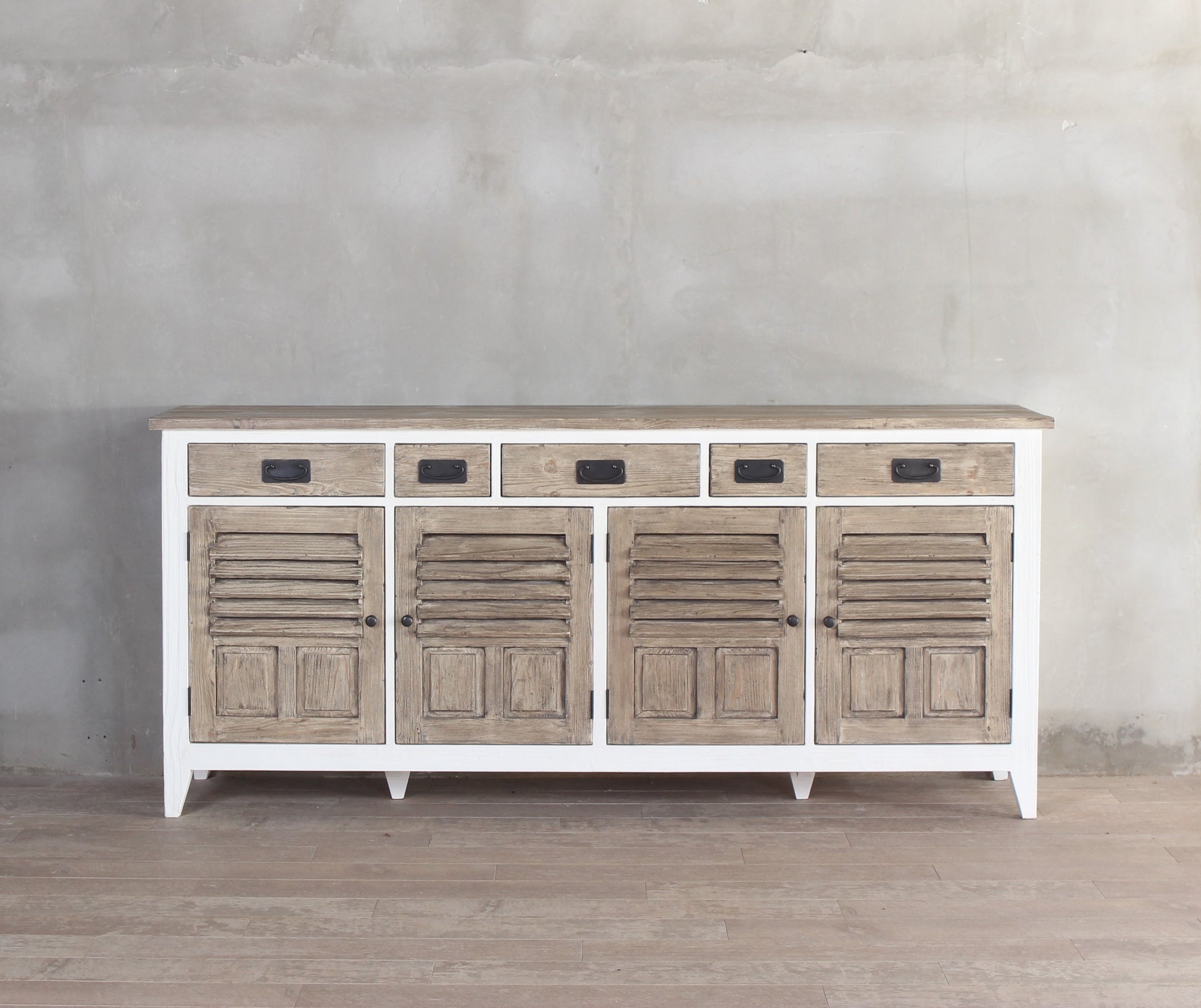 Front view of a coastal white and wooden buffet with doors and drawers