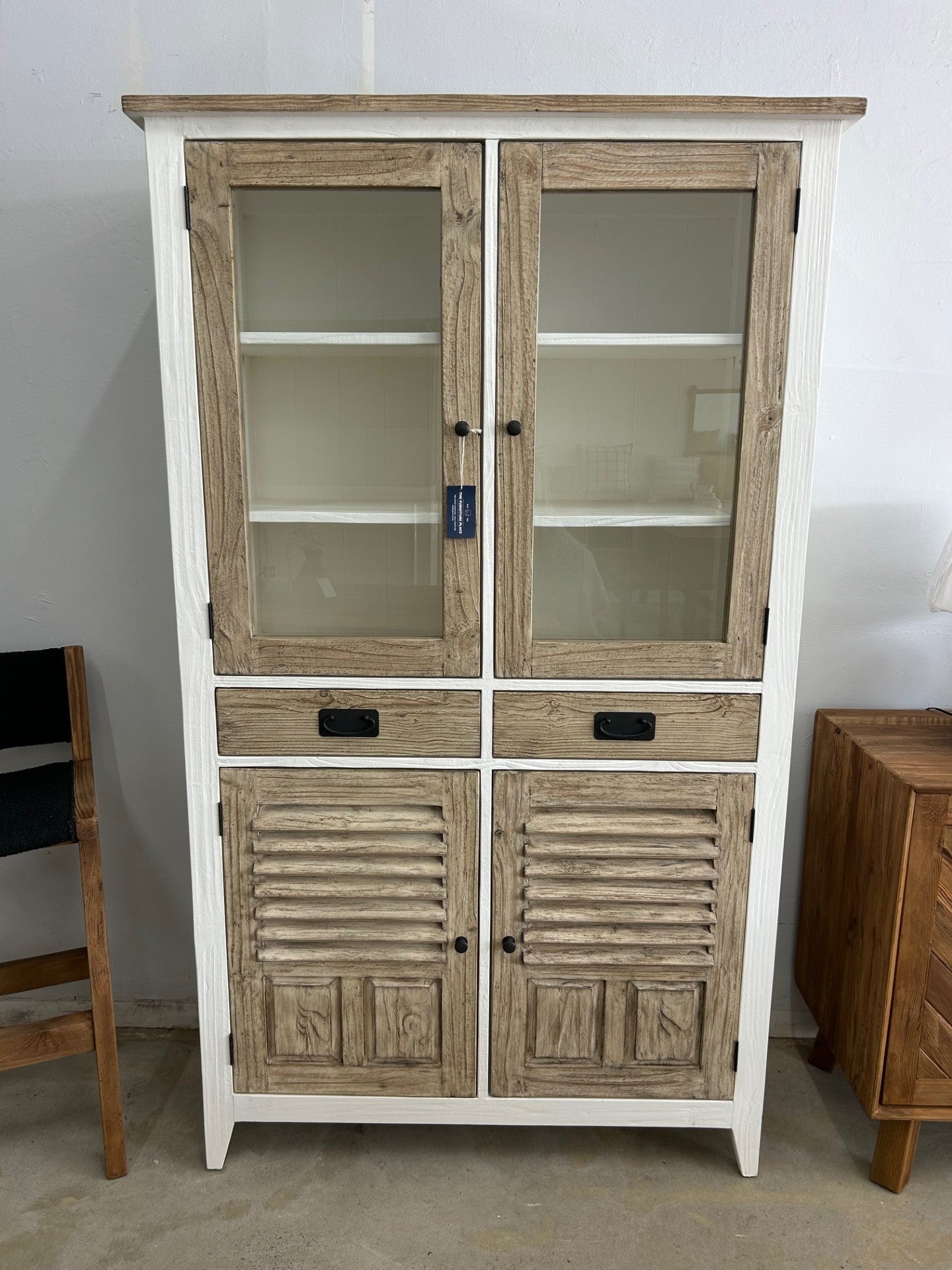 Coastal style display cabinet with glass doors