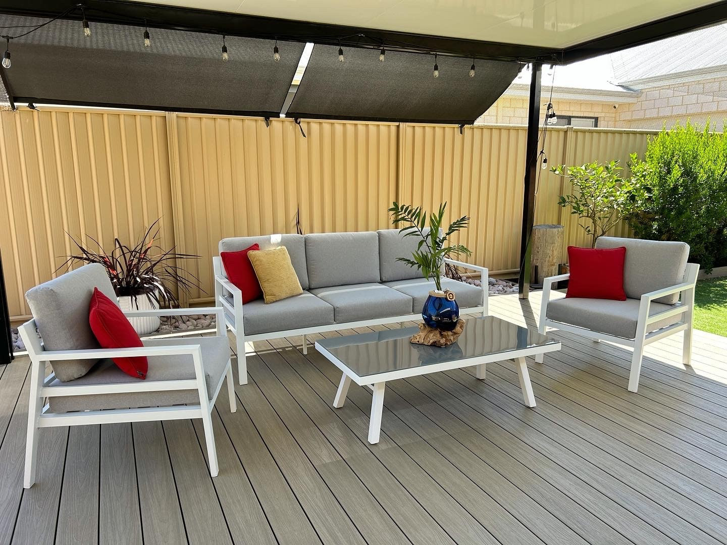White aluminium frame outdoor sofa setting with grey cushions
