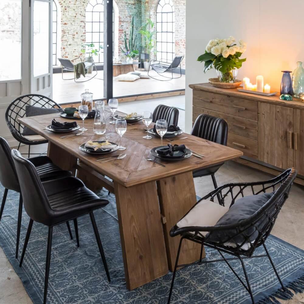 Rustic farmhouse dining table with black dining chairs