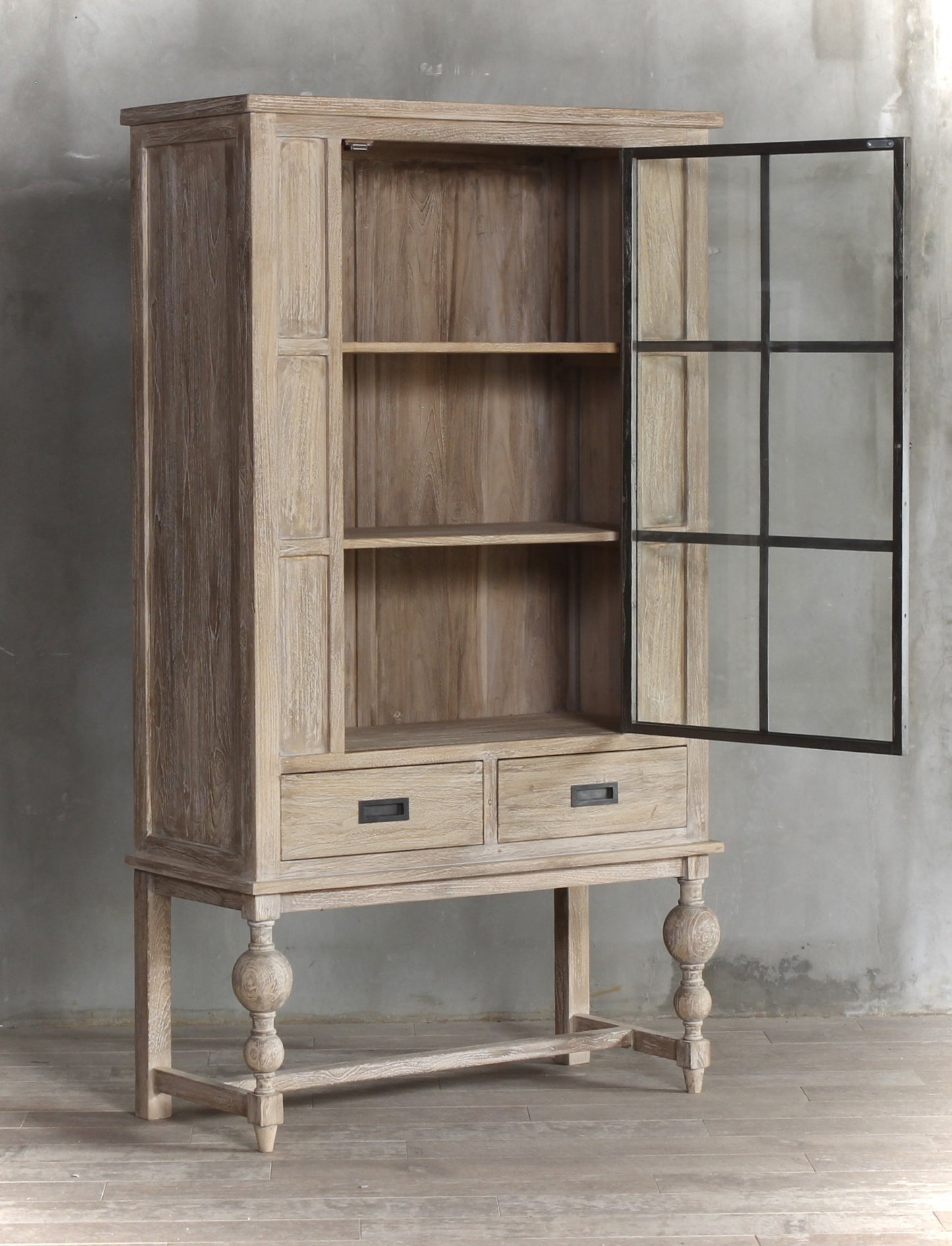 Wooden display cabinet with black metal details and large glass display door