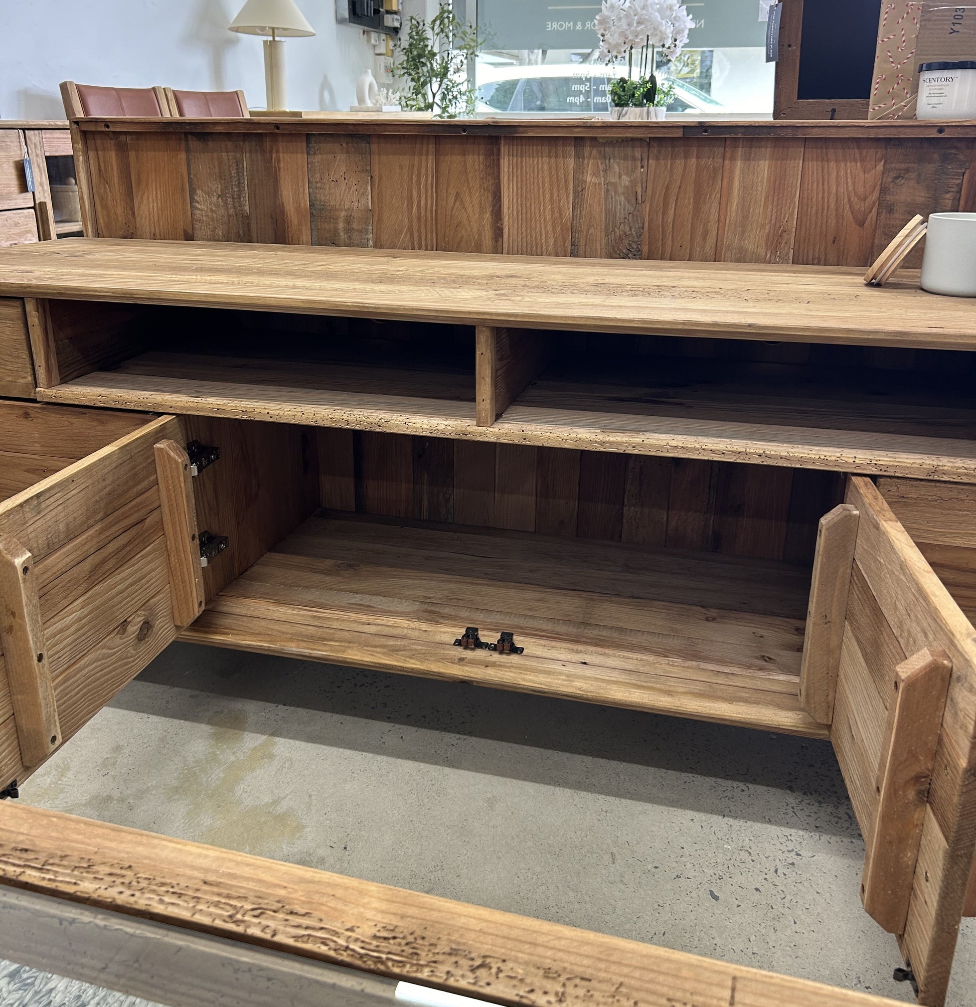 Large shelf storage in a wooden farmhouse style TV Unit