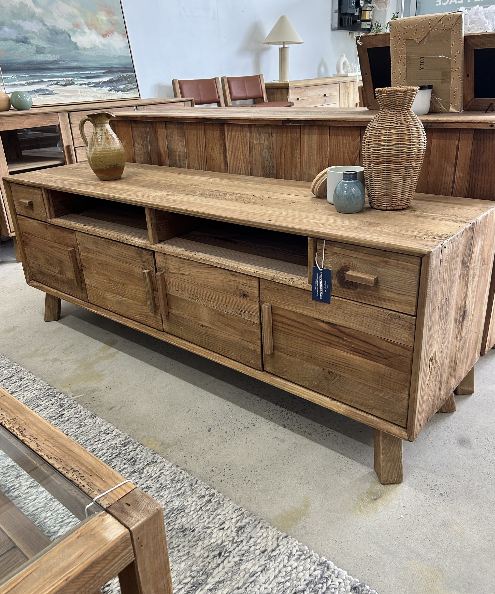 Farmhouse rustic style wooden TV Unit made of reclaimed pine wood with four doors, open shelving, and two drawers