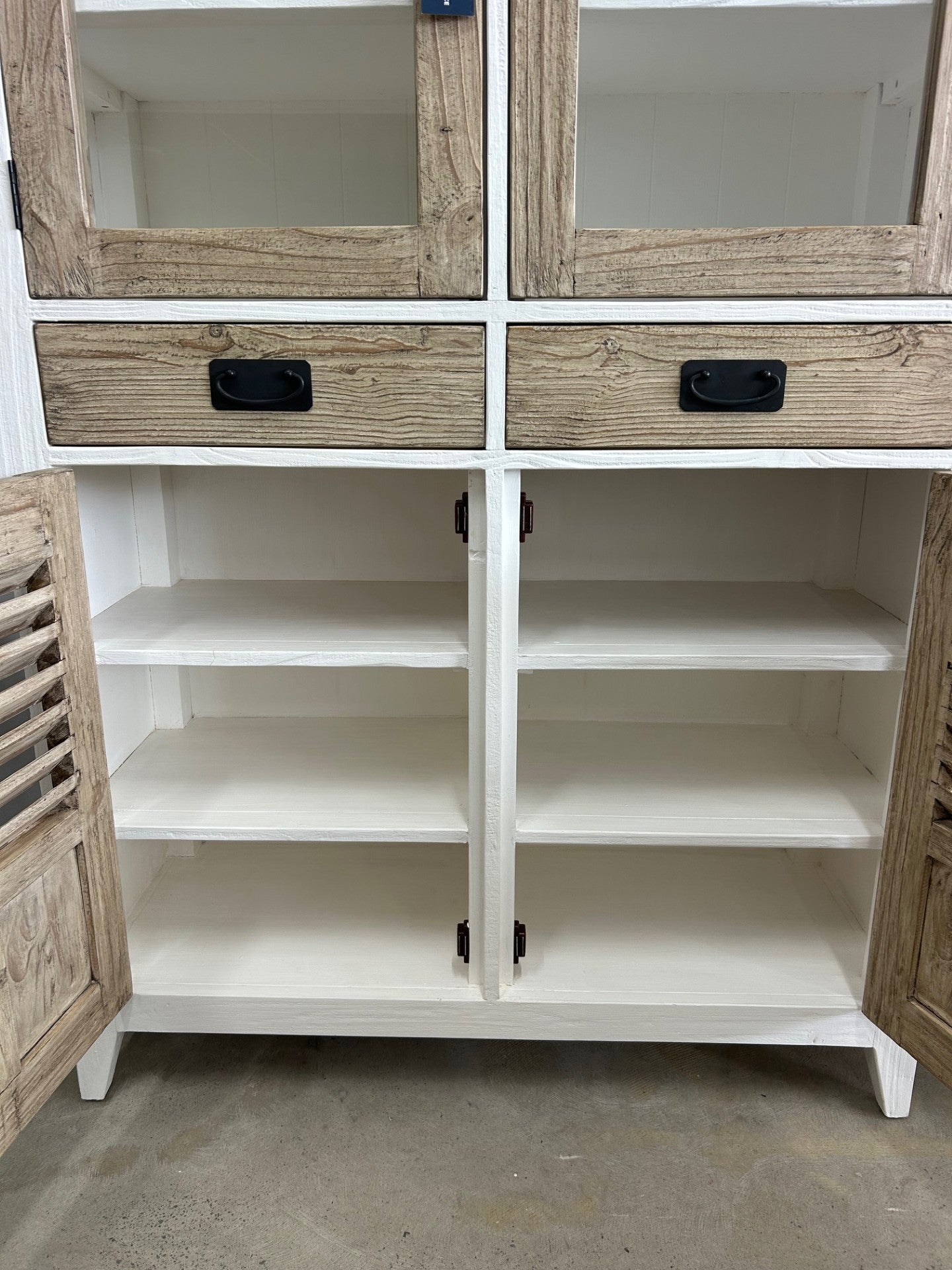 Close up of the large storage space with shelves inside a display cabinet that is 195cm tall
