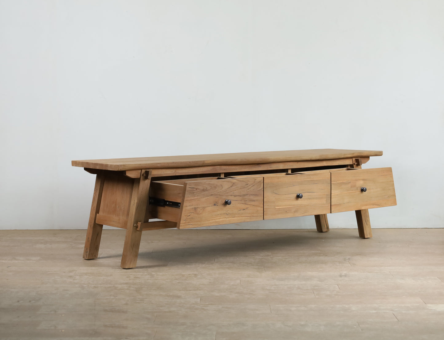 Teak wood TV cabinet with black knob handles, 3 drawers and angled legs
